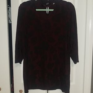 Burgundy w/black leaf like flowers